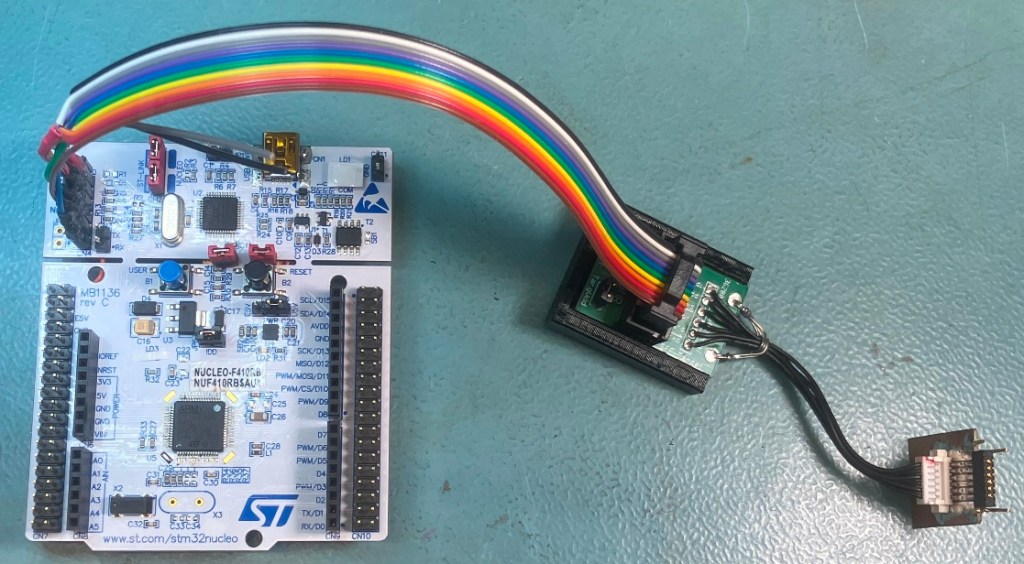 View of the modified Nucleo and the cable used to program the GEN-2 delay boards.