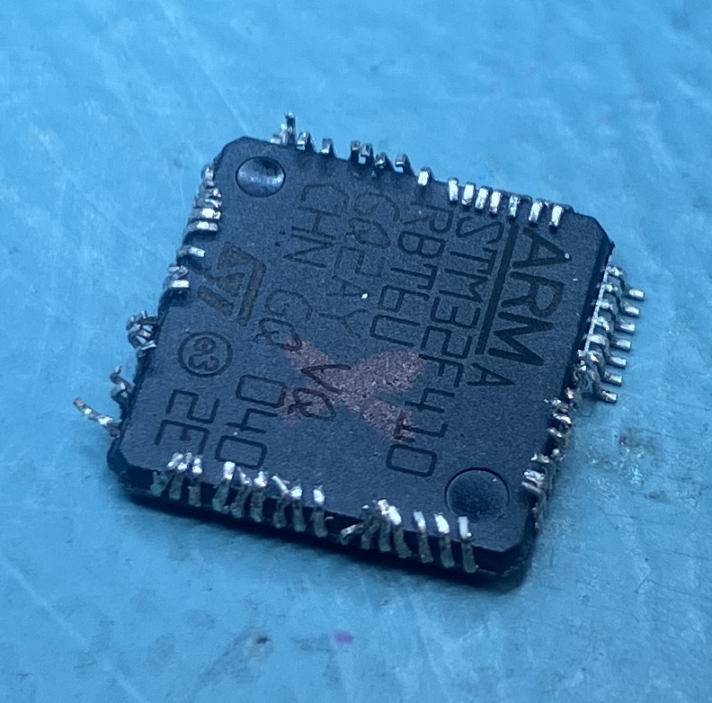 Mangled stm32 processor chip after removal from the Nucleo dev board.