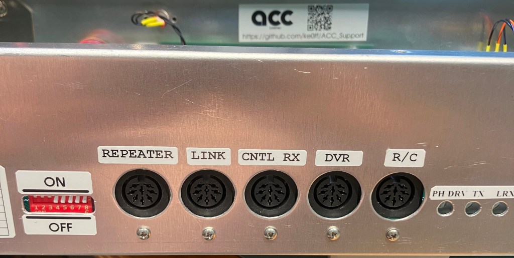 Rear-view of the chassis focused on the DIN connectors.  The grounding screws are visible below each DIN connector opening.